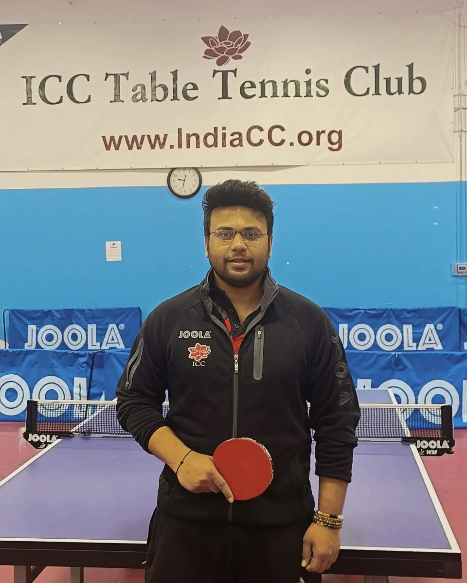 Subham Kundu with his bat beside the table at ICC Table Tennis Club, Milpitas